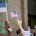 Flags are waved during the last day of school at Estabrook Elementary on Friday, June 7. Daniel Brenner I AnnArbor.com